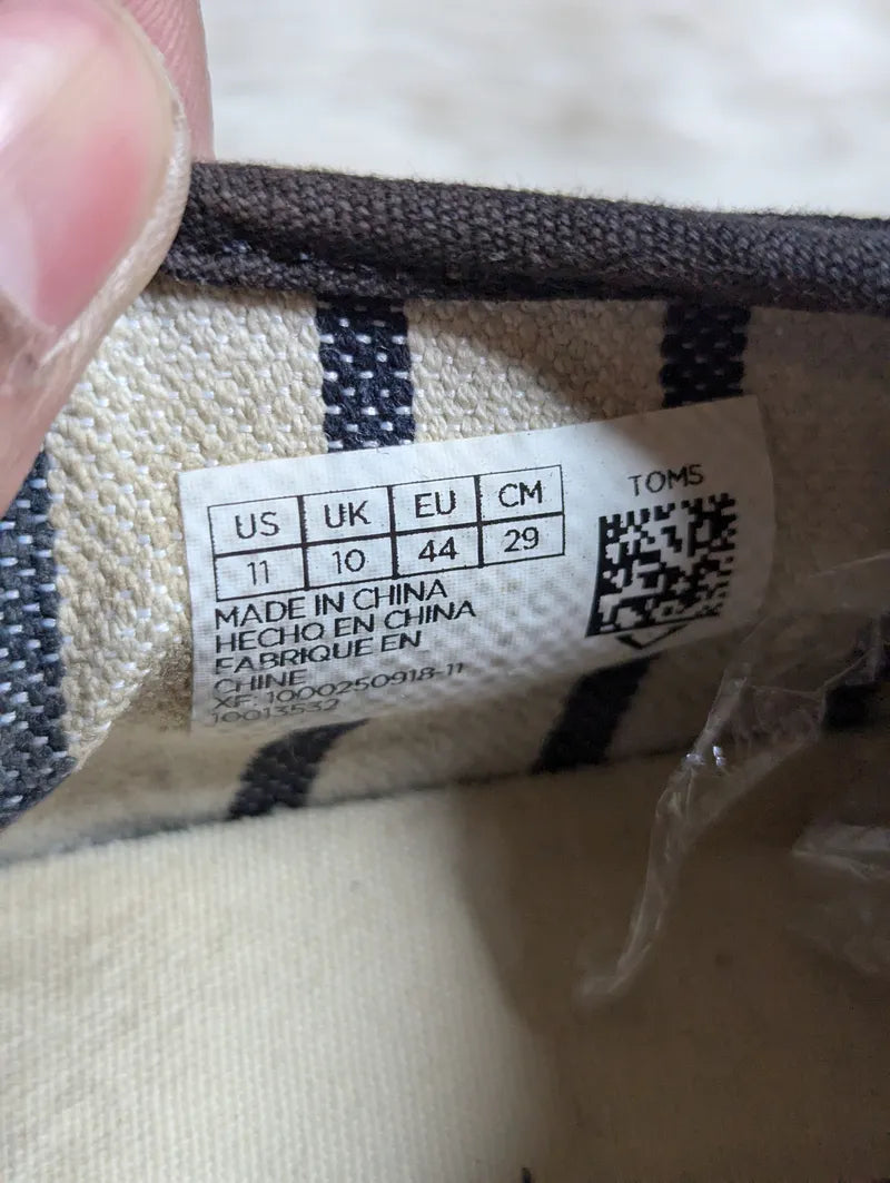 black canvas TOMS Cordones Cupsole lace-up casual sneakers.