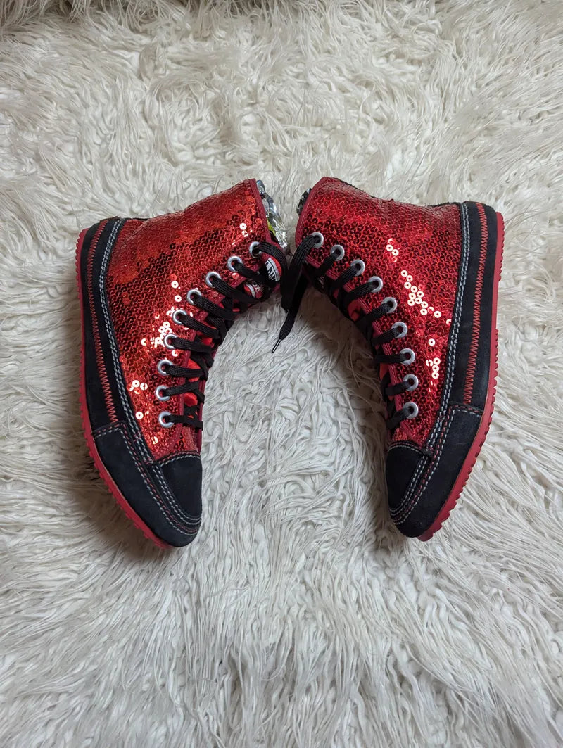 red sequin high-top sneakers with black trim and red rubber soles