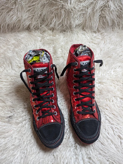 red sequin high-top sneakers with black trim and red rubber soles