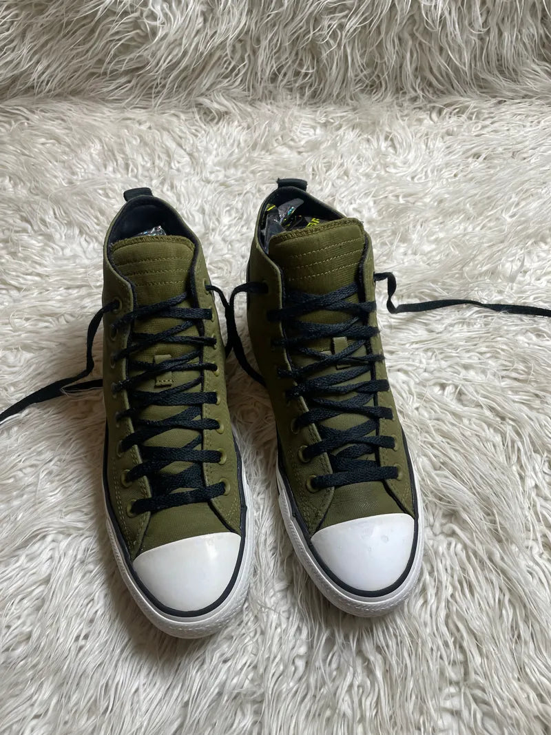 Converse Chuck Taylor All Star TecTuff high-top sneakers in a swamp green or dark moss colorway with black laces and a white rubber sole