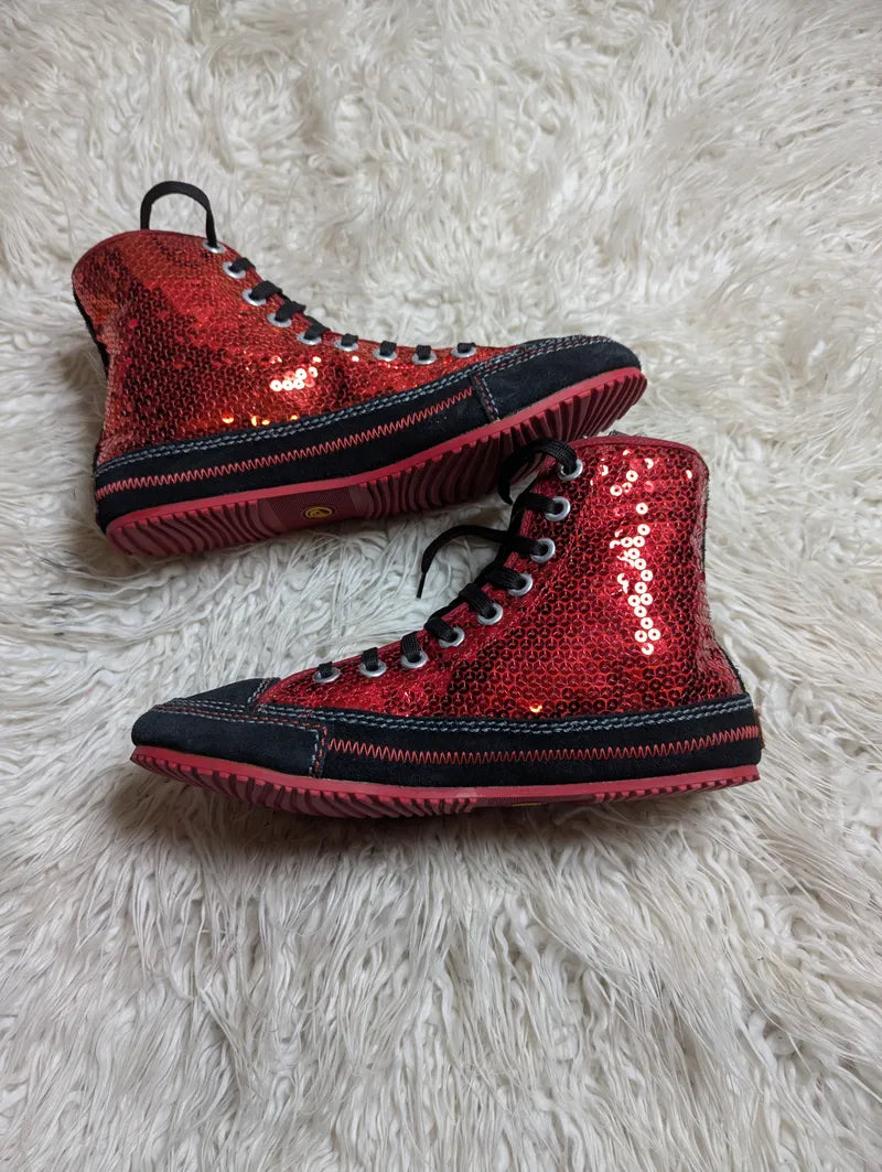 red sequin high-top sneakers with black trim and red rubber soles